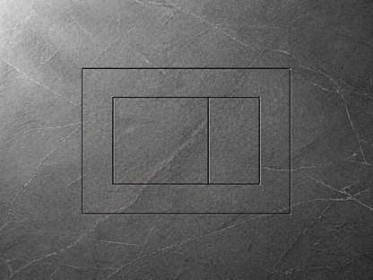 The flush plate outline etched into dramatic dark slate stone